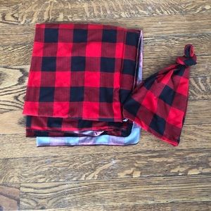 Red and black plaid baby swaddle w/ matching hat.